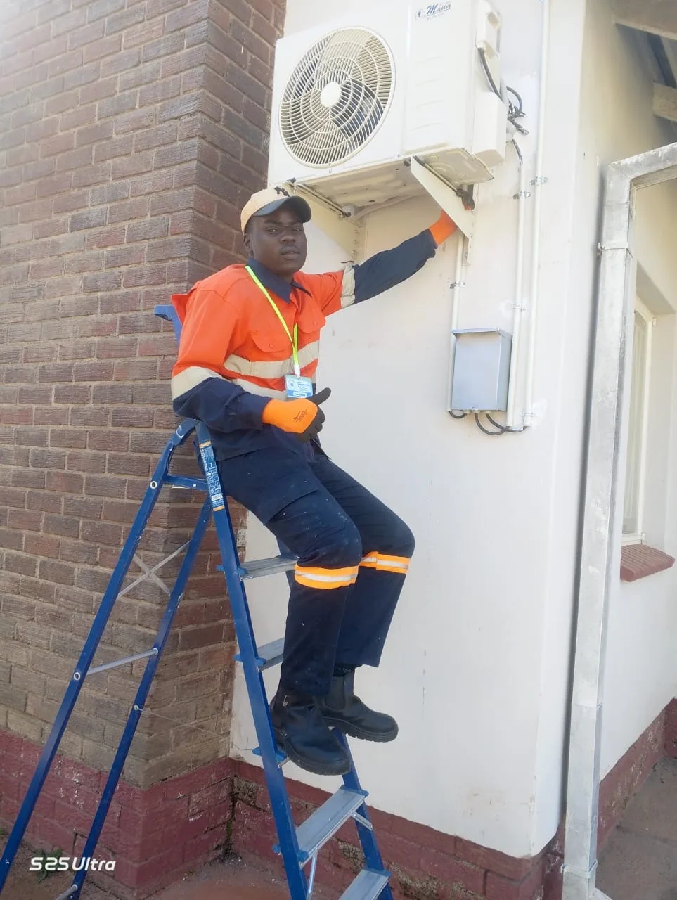 Technician carrying out air-conditioning service work at ZIMRA Forbes Border Post